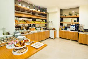 a kitchen with a table with plates of food at Parkhouse Hotel & Spa in Istanbul