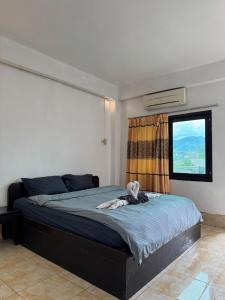 Ένα ή περισσότερα κρεβάτια σε δωμάτιο στο SABAIDEE hotel