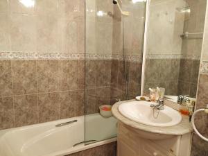 a bathroom with a sink and a shower at Precioso apartamento en el Paraíso Natural  +24 photos