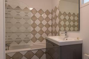 a bathroom with a sink and a shower and a mirror at Les Collines Iduki in Labastide-Clairence +25 photos
