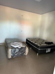 Ένα ή περισσότερα κρεβάτια σε δωμάτιο στο Rancho Fiel - Lago das Brisas