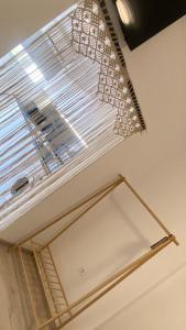 a window with a blind on a ceiling at Rhodes Beach Side Houses in Ixia