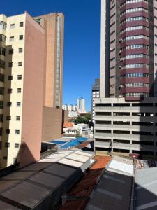 a view of a city with tall buildings at The Flat 311 estacionamento gratuito in Campinas