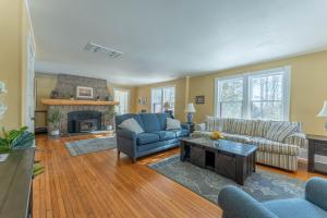 a living room with two couches and a fireplace at Dominion Hill Country Inn in Bocabec