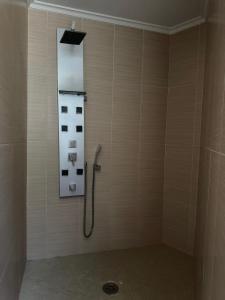 a shower in a bathroom with a mirror at Apartmento Camino a Lancha cerca de la Playa de Usgo y Robayera in Miengo +18 photos