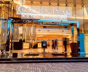 a store front of a golden peak hotel and suites at City & Mountain View Condotel Near Ayala in Cebu City