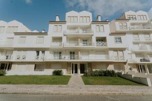 a large white building with balconies on it at Best Houses 40 - You me and the sea in Ferrel