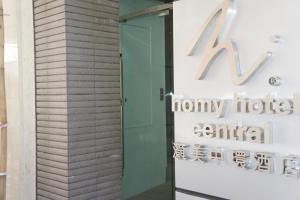 a sign for a honey hotel entitled ak horizons exhibit at Homy Central in Hong Kong