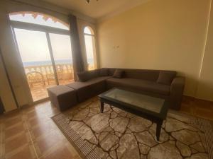 a living room with a couch and a coffee table at Blue view villas&apartments in Dahab