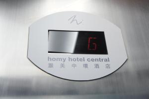 a close up of a harry honorary hotel central clock at Homy Central in Hong Kong