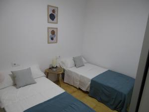 Ένα ή περισσότερα κρεβάτια σε δωμάτιο στο Casasjerezanas Valerian