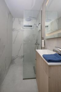 a bathroom with a shower and a sink at La casa di Antonio Corfu in Alepou