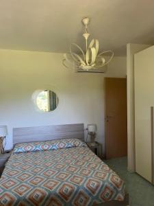 a bedroom with a bed and a ceiling fan at Residenza Le Agavi in Capoliveri in Capoliveri +23 photos