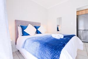 Ένα ή περισσότερα κρεβάτια σε δωμάτιο στο Navy Lagoon Stay The Blyde +20 φωτογραφίες