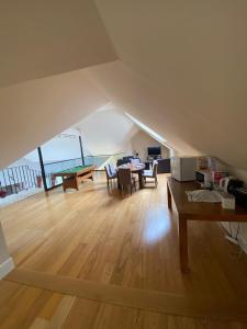 a large living room with a table and a dining room at Barna Liaga House in Tullamore