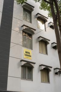 a white building with a hotel tamamma sign on it at Hotel Tamanna - 50 Meter from Golden Temple in Amritsar