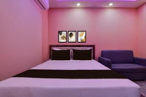 Ένα ή περισσότερα κρεβάτια σε δωμάτιο στο Hotel O Prasad Inn