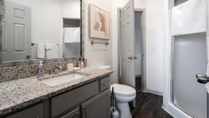 a bathroom with a sink and a toilet at Landing San Antonio Far North Central in San Antonio +57 photos
