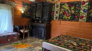 a bedroom with a bed and a wooden wall at Chalet de Bella in Terlo