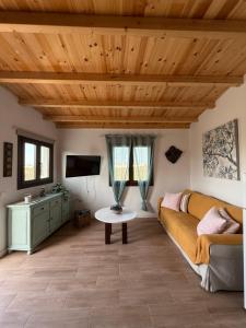 a living room with a couch and a table at Casa Saboa in San Bartolomé