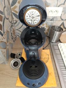 a black blender sitting on top of a table at T3 au calme bien desservi à 10 minutes du Centre in Avignon +6 photos