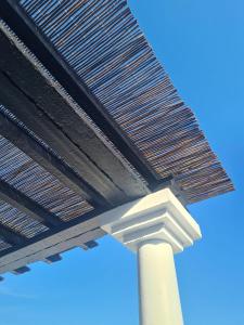 a close up of a bridge with a street light at Ria's Birds in Cabanas de Tavira