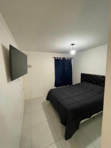 Postel nebo postele na pokoji v ubytování Departamento en Residencias Uru Cure