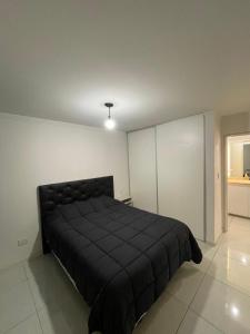 Postel nebo postele na pokoji v ubytování Departamento en Residencias Uru Cure