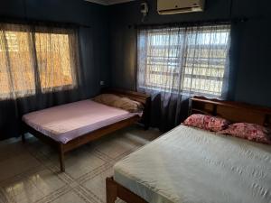 Ένα ή περισσότερα κρεβάτια σε δωμάτιο στο RA-SHA Apartments