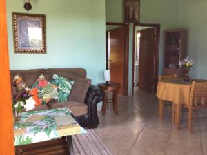 a living room with a couch and a table at Antigua Seaview in Saint Johnʼs +105 photos