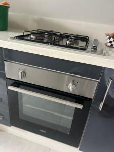 a stove top oven sitting in a kitchen at Cabo Luxury stay in Cabo Negro +24 photos