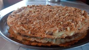 a cake sitting on a plate on a table at GuestHouse Ellie- Elisabeth in Adishi +87 photos