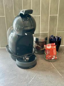 a coffee maker is sitting on a counter at Kleines Landhaus von 1870 in Ruppichteroth +23 photos