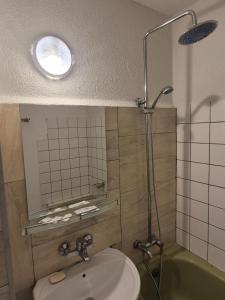 a bathroom with a toilet and a sink and a shower at Mladost stay apartment in Sofia