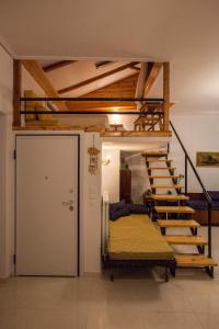 a room with a bunk bed and a staircase at Argo Luxury House in Volos