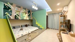 a bedroom with a bed and a wall with plants at Wawa Ocean Family B&B in Taitung City