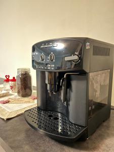 a black coffee maker sitting on top of a counter at Dolce Settembre in Châtillon