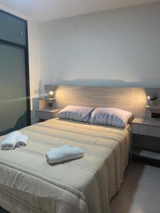 En eller flere senge i et værelse på Hospedaje Umma 3-Ezeiza