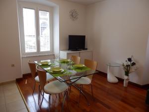 a dining room with a glass table and chairs at Apartment Pula Center in Pula