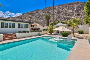 a swimming pool in front of a house with a mountain at Villa LaQuinta Free Pool Heating RV Parking at Point Happy in La Quinta