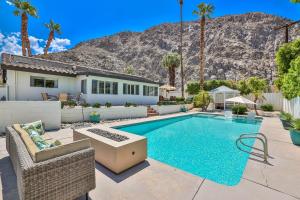 a home with a swimming pool and a house at Villa LaQuinta Free Pool Heating RV Parking at Point Happy in La Quinta
