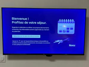 a monitor with a blue screen with a software website at Apartment - Abbaye aux Dames, reserved parking in Saintes