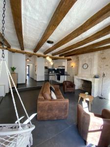 a living room with two couches and a fireplace at Appartement de charme L'écrin du Castel Classé 3 étoiles in Azay-le-Rideau