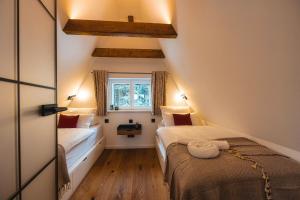 Postel nebo postele na pokoji v ubytování Ahornallee - Erzgebirge