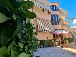 a building with plants in front of it at Vila Rrodhe in Durrës