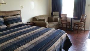 Postel nebo postele na pokoji v ubytování Tantramar Motel