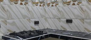 Kuchyň nebo kuchyňský kout v ubytování Appartement chic et moderne à Kénitra + 7 fotografií