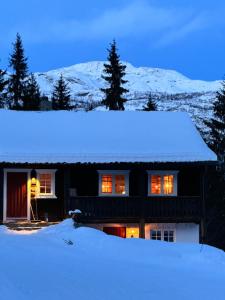 Το Ski lodge with sauna and hot tub τον χειμώνα