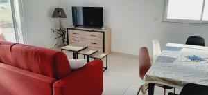 Un televizor și/sau centru de divertisment la Bel appartement Corse côte Est +3 fotografii