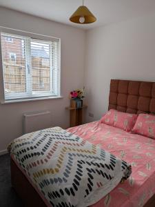 a bedroom with a bed and a window at Rossetti in Bristol